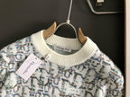 Dior knit sweater crew neckline, ribbed collar and cream cuffs, multicolor pattern