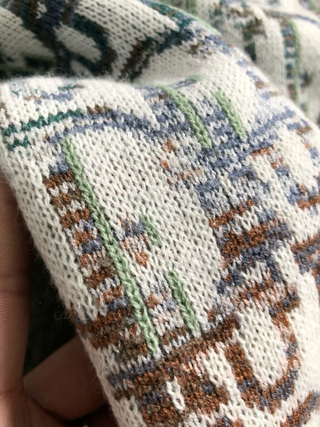 Dior knit sweater close-up, cream knit with blue and green scattered pattern
