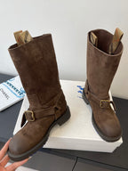 Burberry dark brown suede knee-high boots, angled view with buckle strap detail