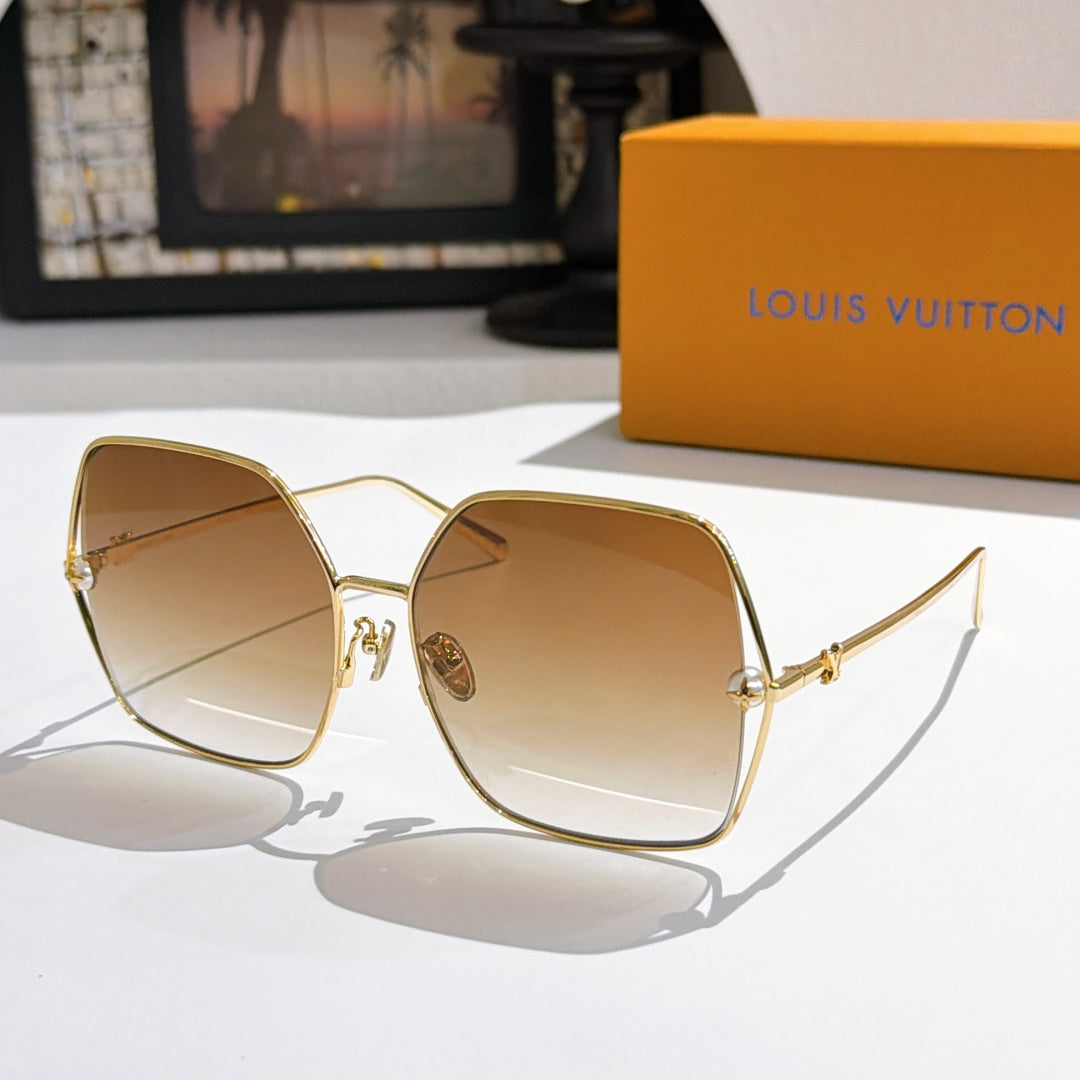 Louis Vuitton sunglasses with gold frames and amber gradient lenses