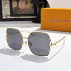 Louis Vuitton sunglasses with gold frames and cool gray gradient lenses