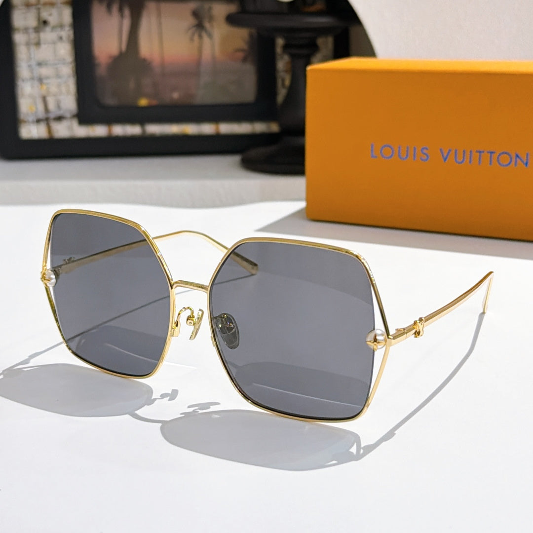 Louis Vuitton sunglasses with gold frames and cool gray gradient lenses