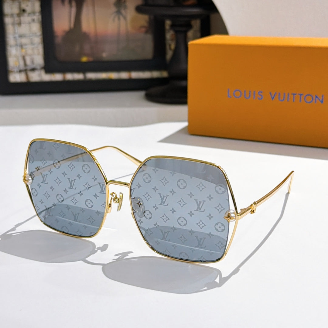 Louis Vuitton sunglasses with gold frames and light blue gradient lenses