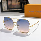 Louis Vuitton sunglasses with gold frames and deep blue gradient lenses