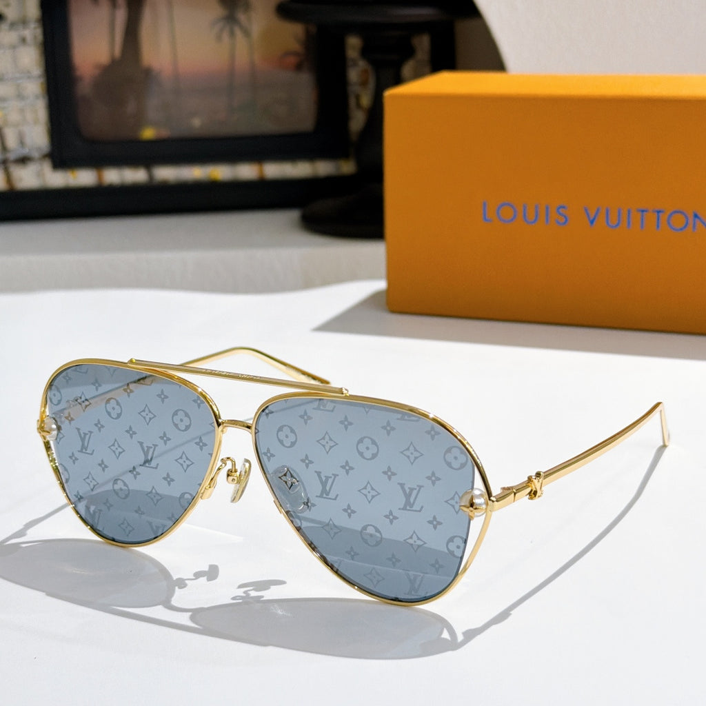 Louis Vuitton aviator sunglasses, gold frame, light blue-tinted lenses