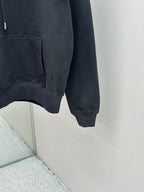 Dark blue hoodie close-up of lower front and kangaroo pocket, ribbed cuffs