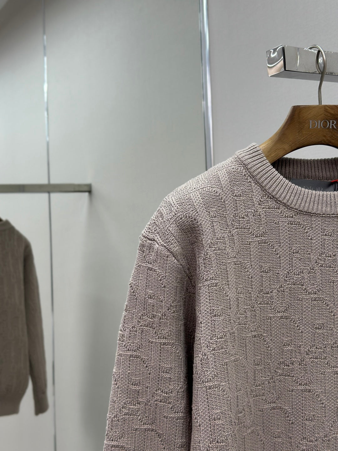 Dior mauve logo knit sweater close-up, crewneck ribbing and sleeve cuff