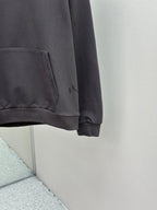 Dark gray hoodie with front pocket and ribbed hem, long-sleeve hooded sweatshirt