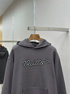 Dark gray long-sleeve hoodie with hood and Louis Vuitton logo on chest