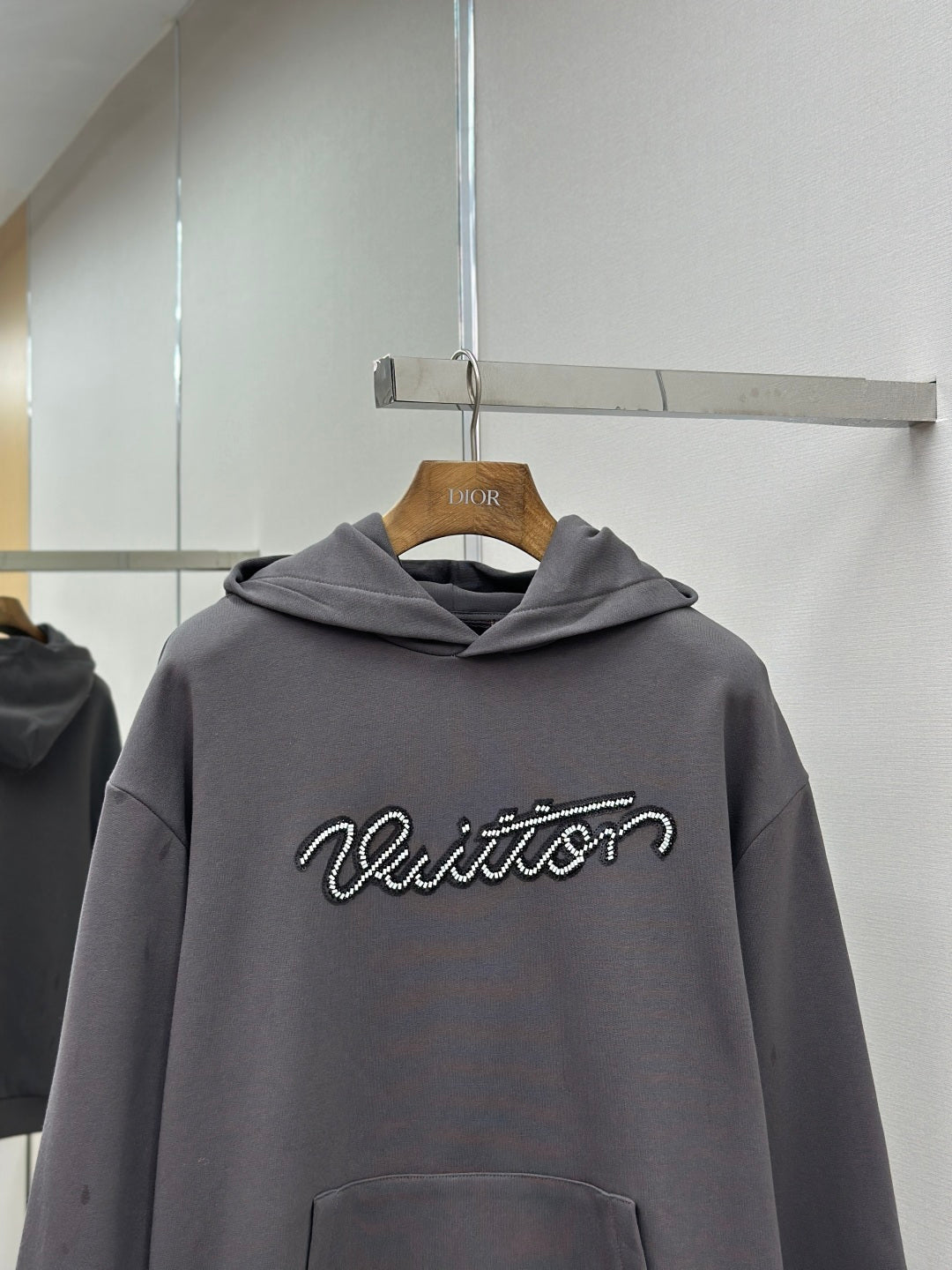 Dark gray long-sleeve hoodie with hood and Louis Vuitton logo on chest