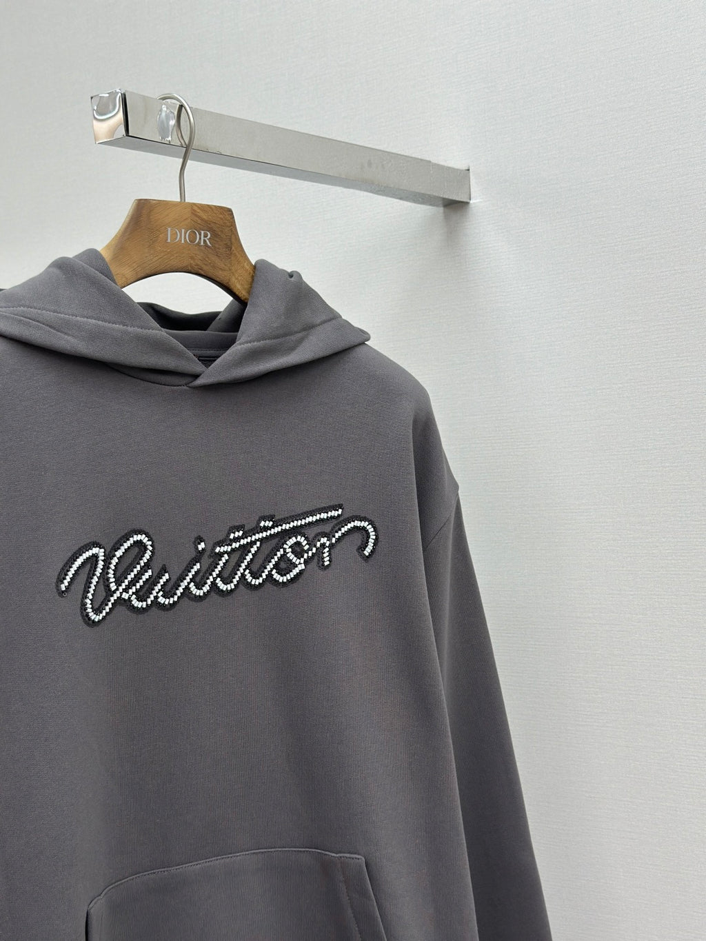 Dark gray hooded sweatshirt with Louis Vuitton logo and front pocket
