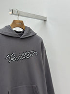 Dark gray hooded sweatshirt with Louis Vuitton logo and front pocket