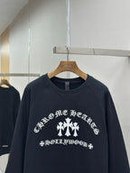 Navy crewneck sweatshirt close-up of white front graphic and text