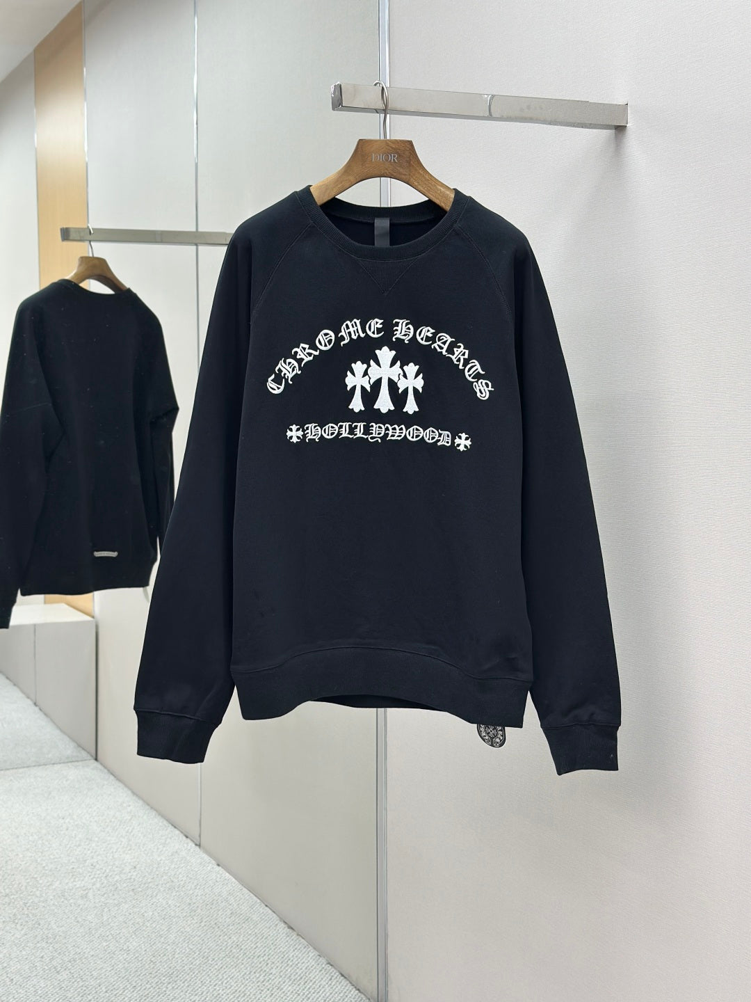 Navy crewneck long-sleeve sweatshirt with large white cross graphic on front