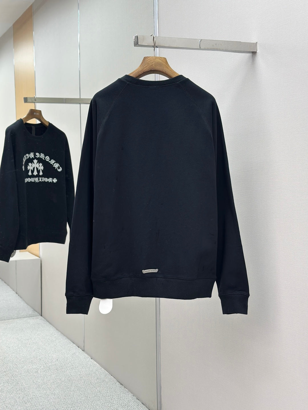 Navy crewneck long-sleeve sweatshirt, back view