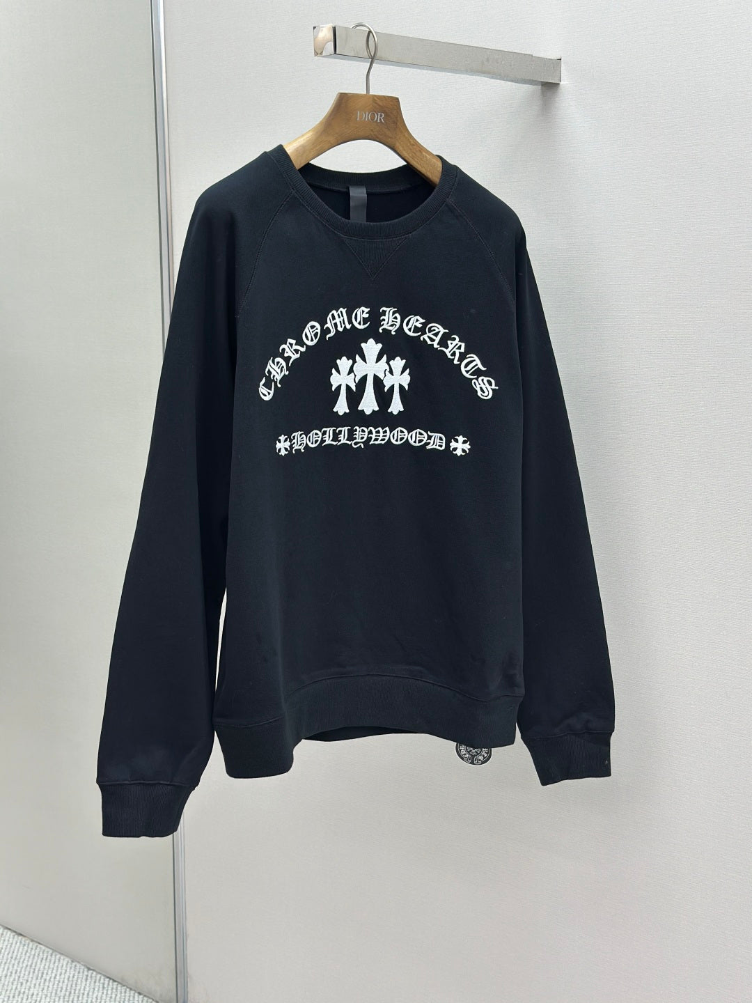Navy crewneck sweatshirt with front white cross and slogan print