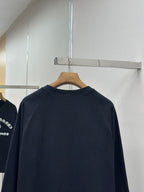 Navy crewneck long-sleeve sweatshirt back view on hanger