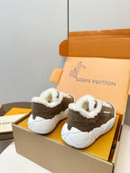Brown high-top sneakers with plush white lining and thick white sole