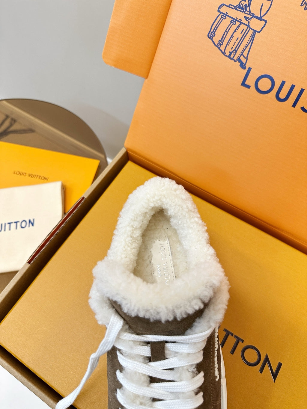 Brown sneaker with white plush collar and white lace-up eyelets