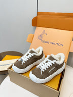 Brown high-top sneakers with plush white collar and white lace-up front