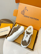 Brown slip-on sneakers with plush sherpa collar and white rubber sole