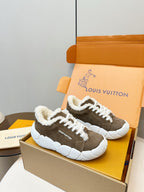 Brown sherpa sneakers with white laces and chunky white sole