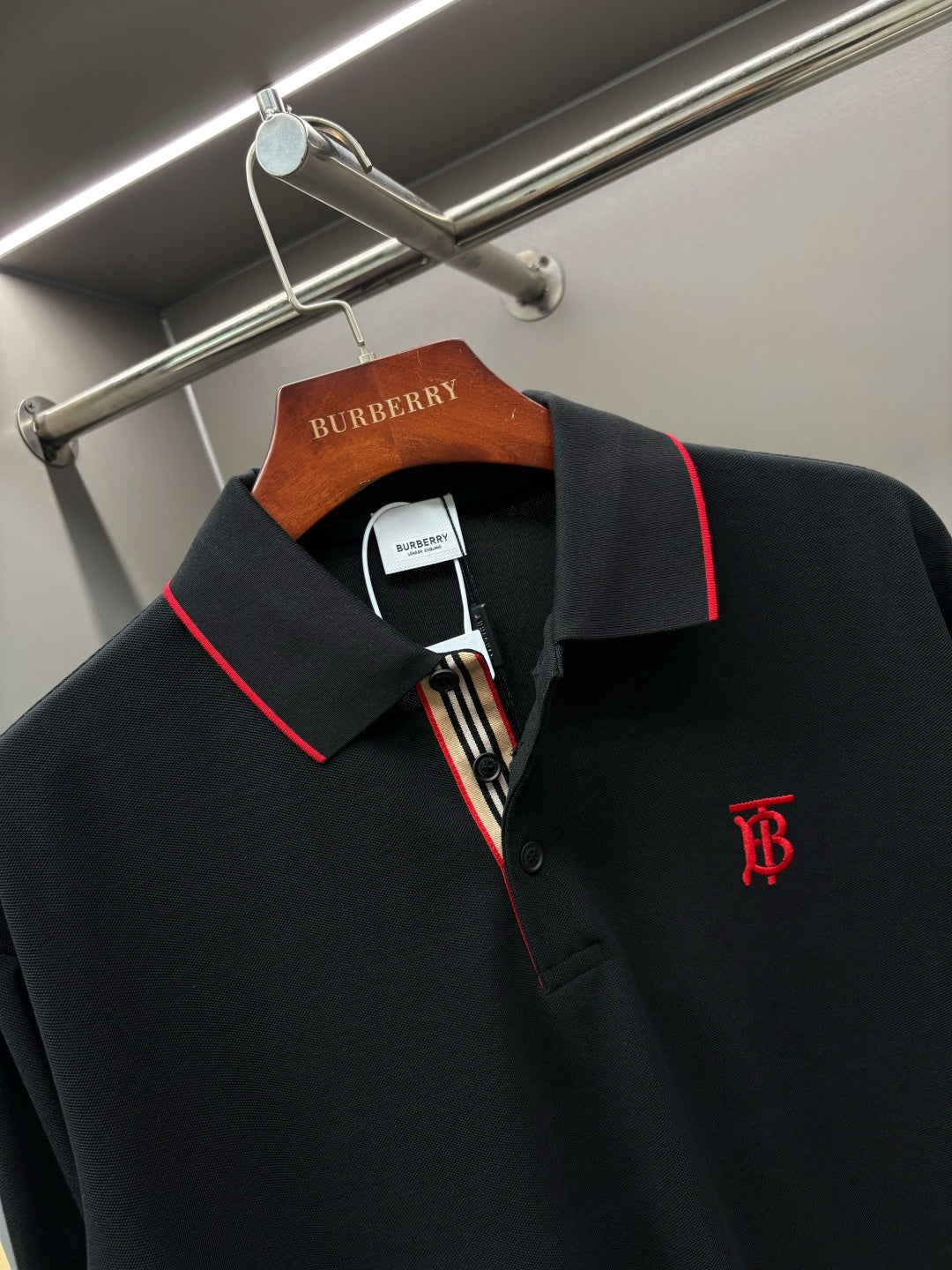 Long-sleeve polo shirt with red-trim collar and monogram logo on chest
