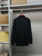 Long-sleeve polo shirt full back view in dark black, unpatterned
