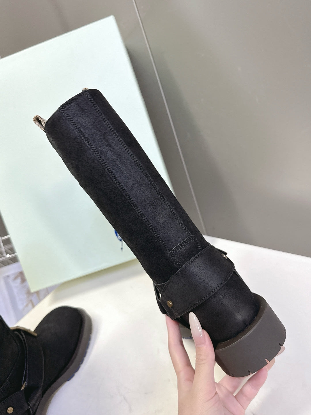Black suede pull-on boot with elastic gore and low rubber sole
