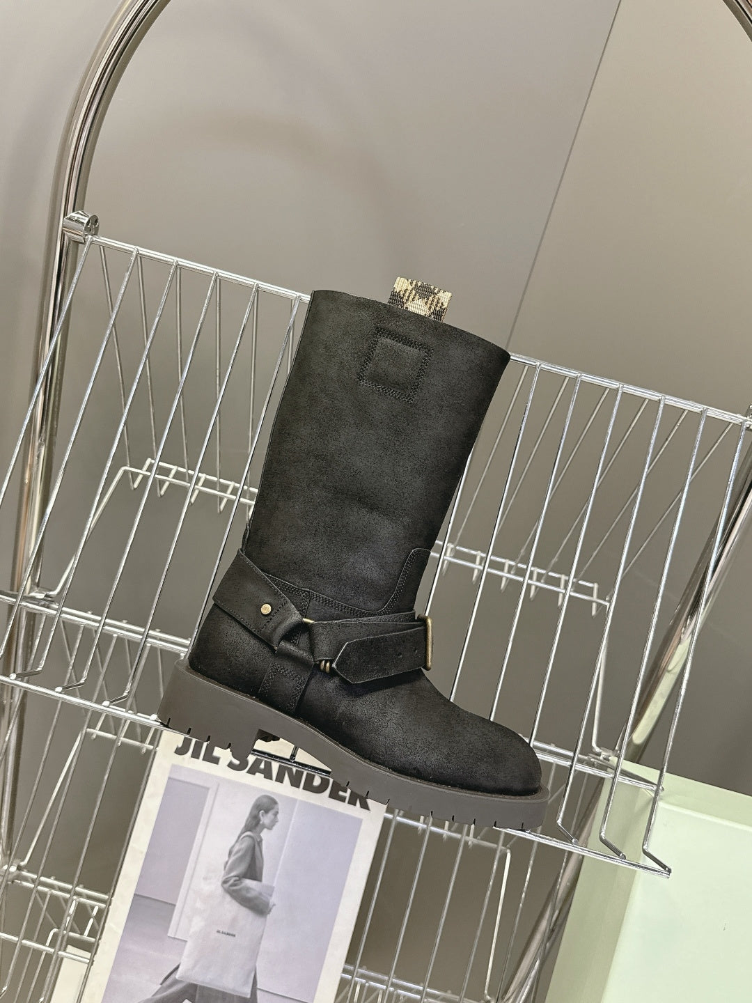 Black suede tall boots with side buckle strap and low platform sole