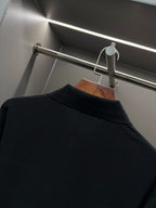 Black Burberry long-sleeve polo shirt back collar close-up