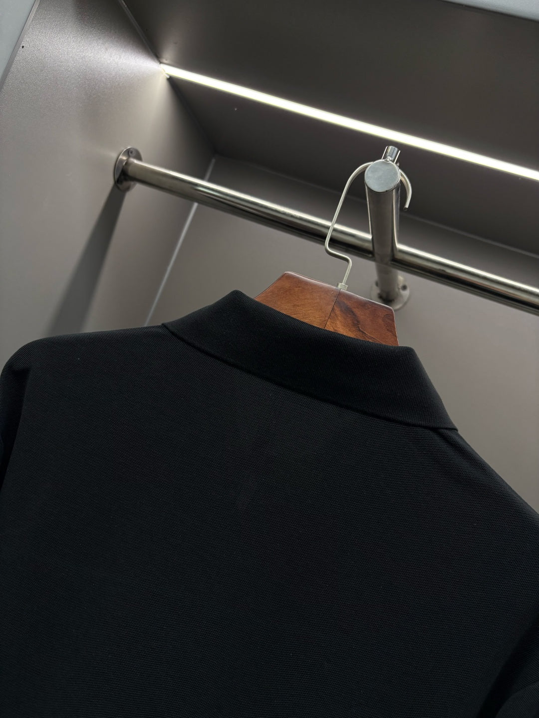 Black Burberry long-sleeve polo shirt back collar close-up