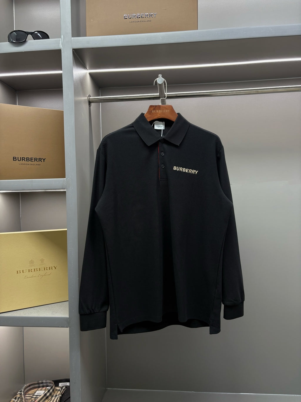 Black Burberry long-sleeve polo shirt with button placket and chest logo