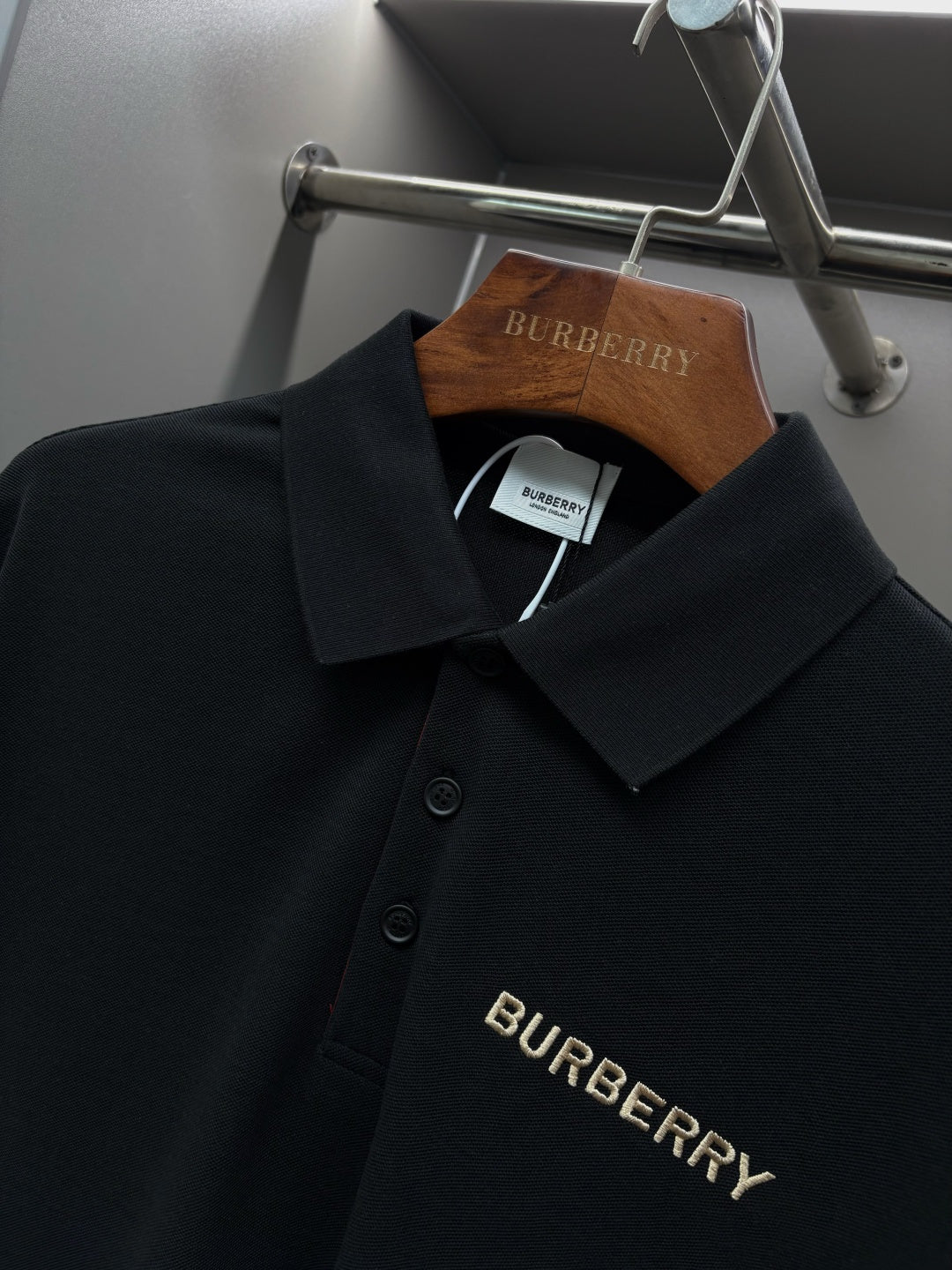 Black Burberry long-sleeve polo shirt collar and buttons with logo