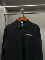 Black Burberry long-sleeve polo shirt with spread collar and chest logo