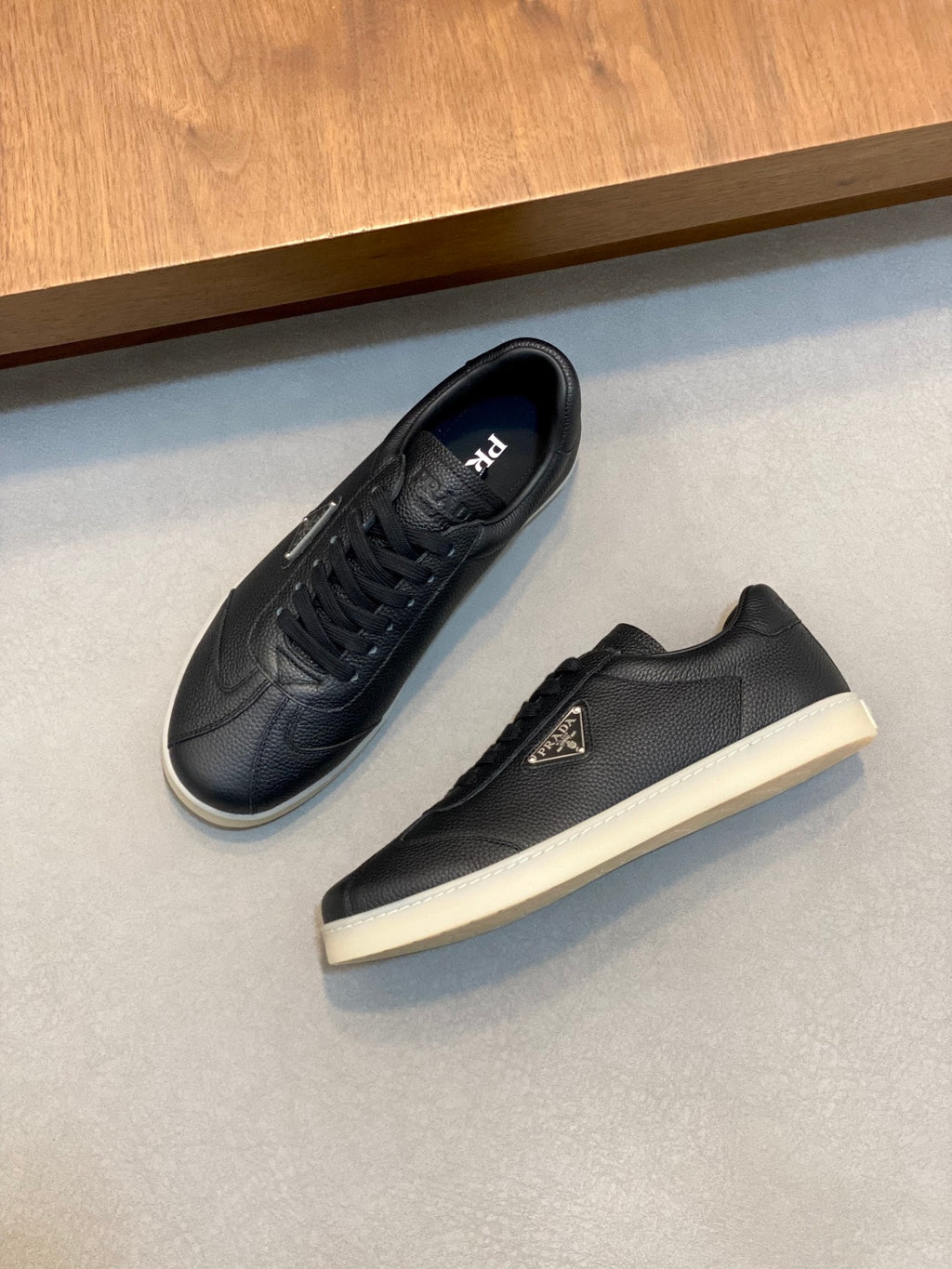 Prada unisex low-top sneakers, dark leather, lace-up, side logo, white sole