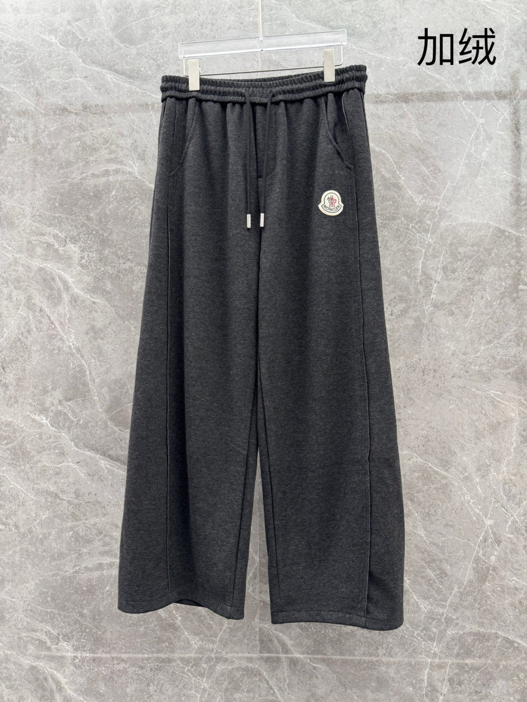Charcoal grey sweatpants, elastic waistband, straight loose legs, drawstring
