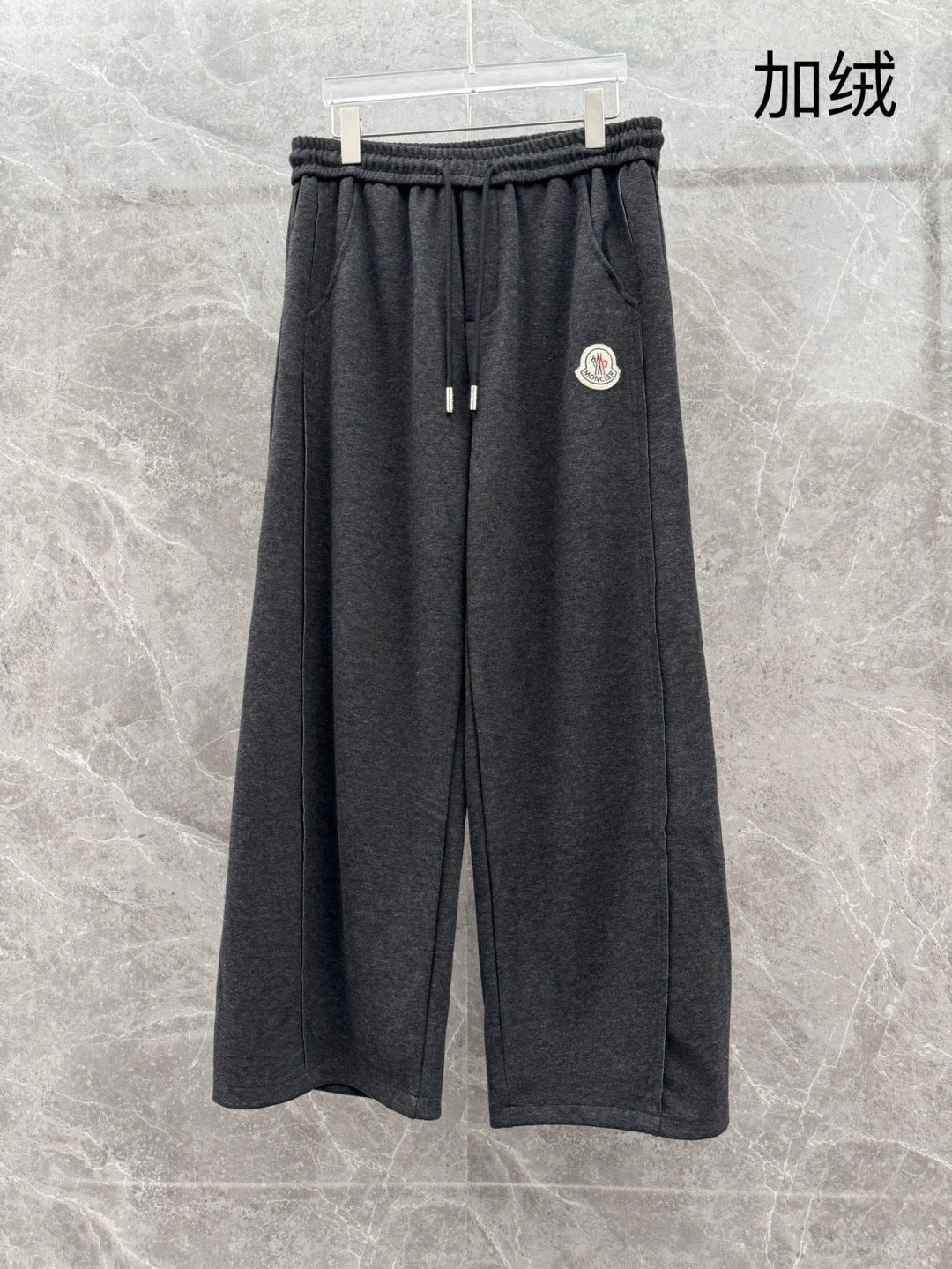 Charcoal grey sweatpants, elastic waistband, straight loose legs, drawstring
