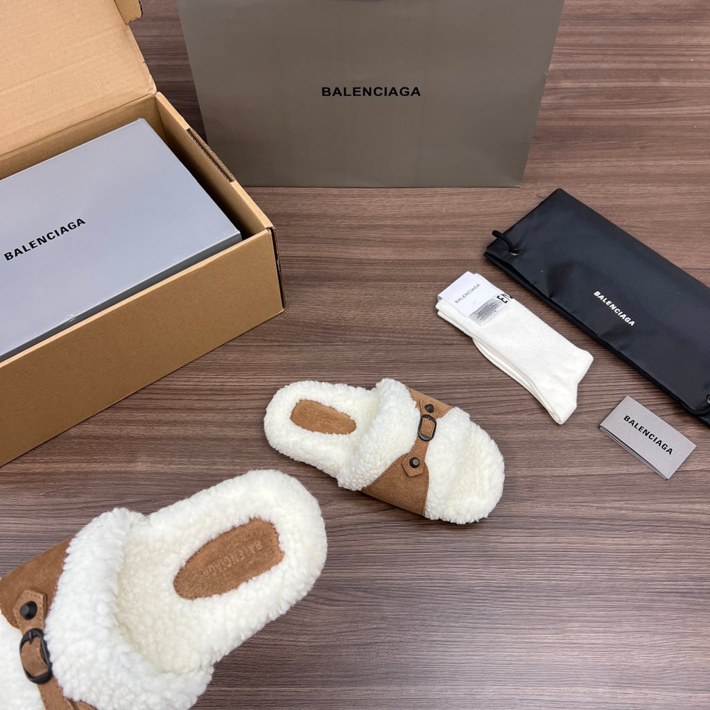 White plush Balenciaga sandals with tan buckle straps and oval toe openings, close view