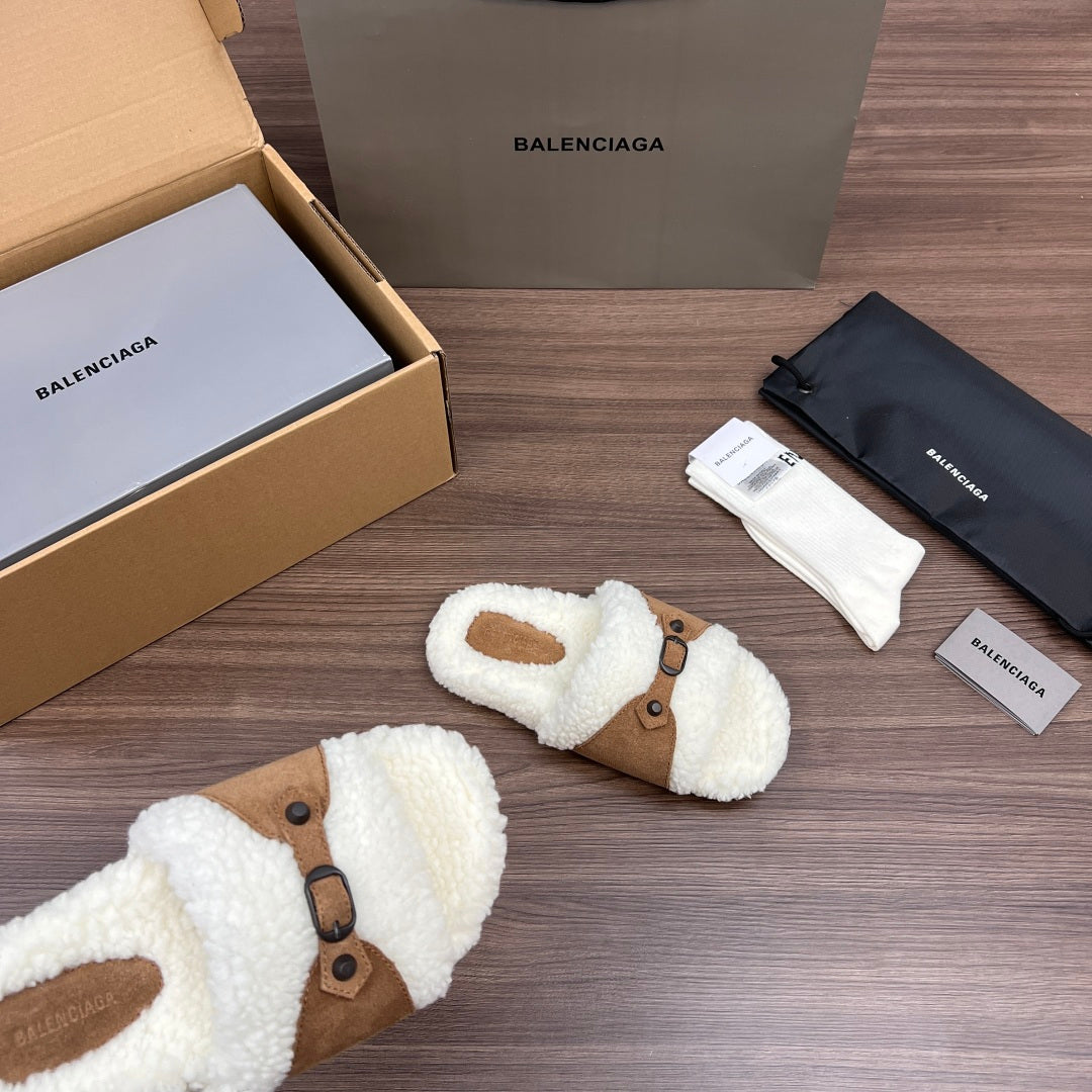 White plush Balenciaga sandals with tan strap and buckle detail, side view