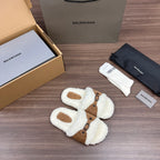 Cream plush Balenciaga slide sandals with tan buckled straps and oval toe openings