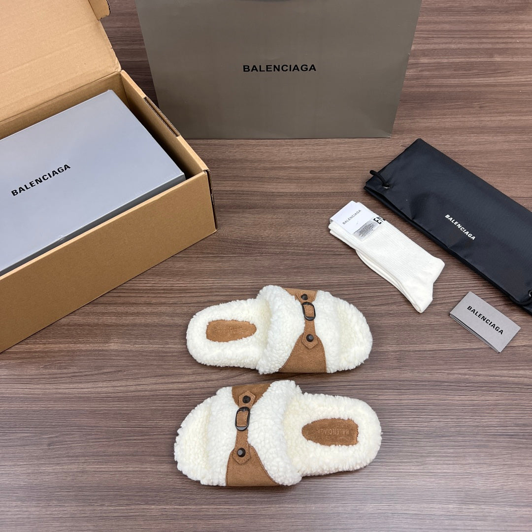 White plush Balenciaga sandals with tan cross straps and buckle details, pair view