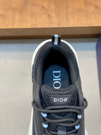 Dior sneaker tongue and laces close-up, blue stripe detail, mesh and leather upper