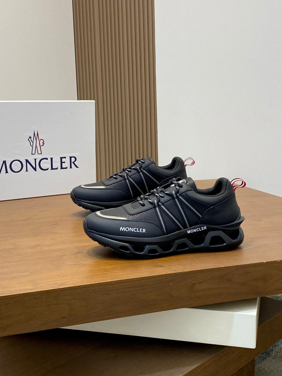 Moncler dark lace-up sneakers with MONCLER logos and chunky tread sole