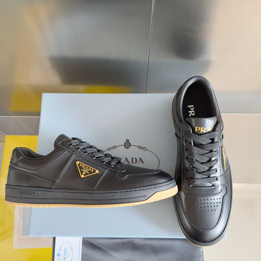 Prada unisex sneakers on box, dark gray leather, lace-up with side logo patch