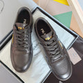 Prada unisex leather sneakers, dark gray, lace-up with perforated toe and logo patch