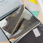 Prada unisex sneakers, dark gray leather, lace-up with triangular logo patch and gum sole