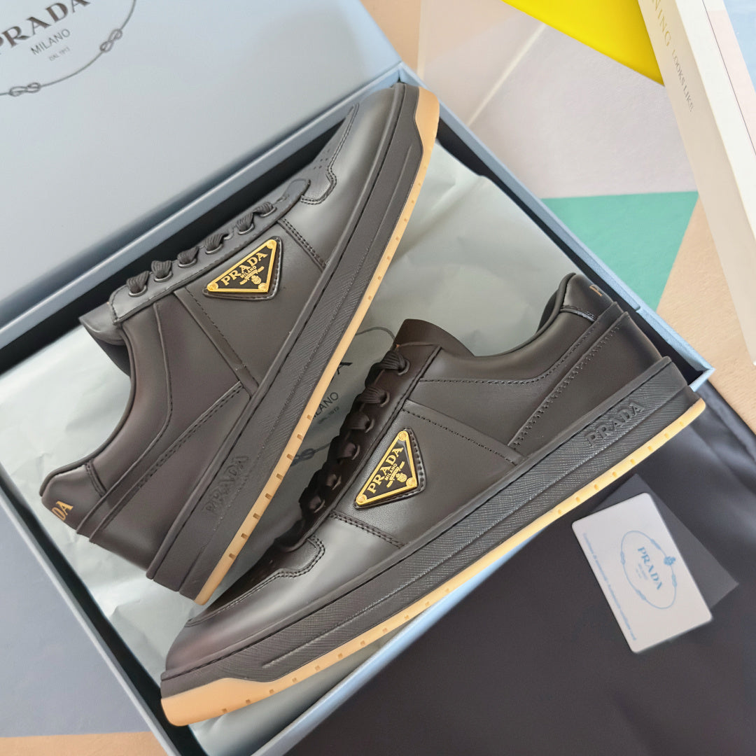 Prada unisex sneakers, dark gray leather, lace-up with triangular logo patch and gum sole