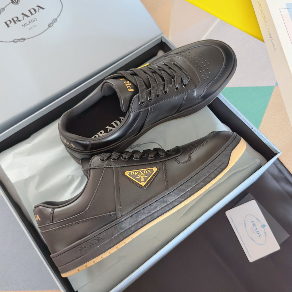 Prada unisex sneakers, dark gray leather, lace-up with triangular logo patch and gum sole