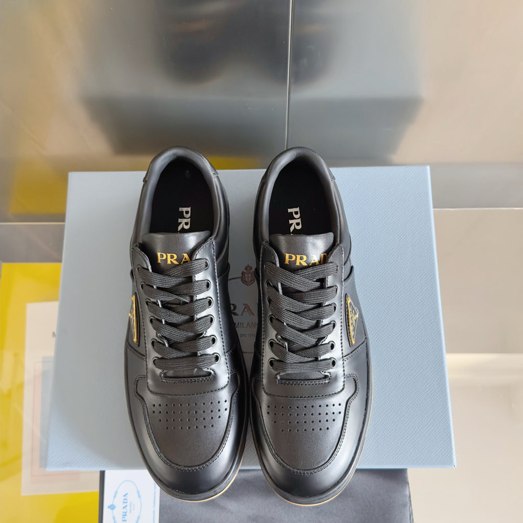 Prada unisex sneakers, pair view, dark gray leather with lace-up and perforated detailing